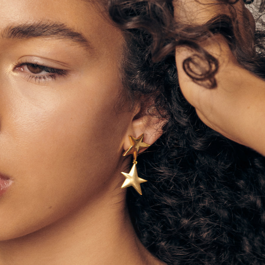dangly gold star earrings