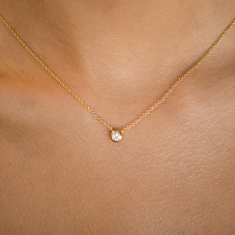 dainty gold crystal pendant necklace with a thin chain