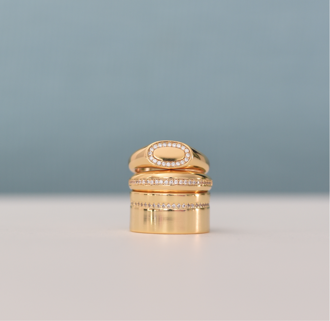 small gold signet ring with crystals
