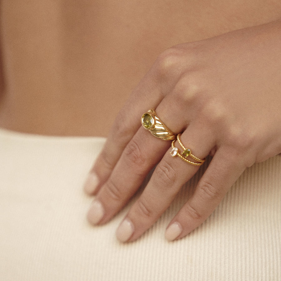 thin gold ring with olive green stone